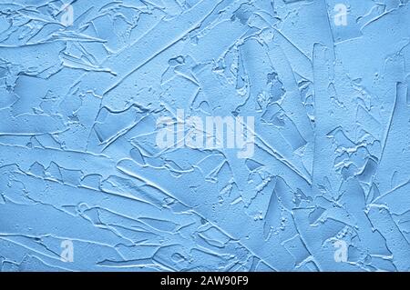 Texturized blue putty. Vintage background of venetian stucco texture. Monochrome abstract background. Close up. Stock Photo