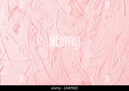 Texturized pink putty. Vintage background of venetian stucco texture. Monochrome abstract background. Close up. Stock Photo