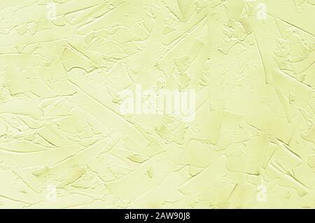 Texturized yellow putty. Vintage background of venetian stucco texture. Monochrome abstract background. Close up. Stock Photo