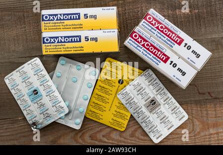 Cork, Ireland - 24th March 2019: Boxes and packs of OxyContin and Oxynorm pills on a wooden table, OxyContin is prescribed for severe pain but is know Stock Photo