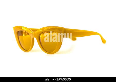 Yellow cat eye frame sunglasses isolated in white background, side view Stock Photo