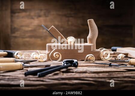 Various Carpenter Tools From Toolkit Laying On Desk Stock Photo