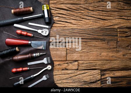 Leather Craft Tools On Desk In Tailoring Workshop Stock Photo