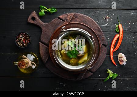 Trout fish soup. Ukrainian cuisine. Top view. Free space for your text. Rustic style. Stock Photo