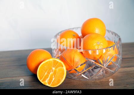 Lead crystal fruit bowl full of oranges 'fruit' against white background Stock Photo