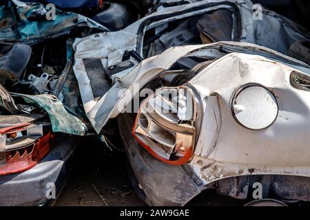 Broken car after an accident on highway, big collision road autobahn. Concept auto recycling. Stock Photo