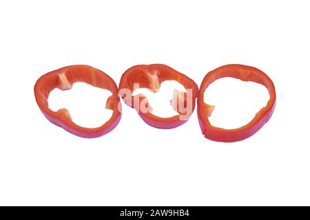 Set of sliced red bell pepper section pieces isolated over white background Stock Photo