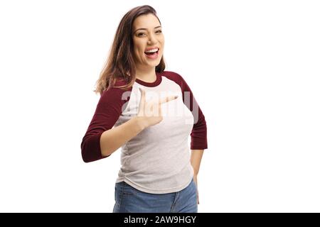 Cheerful young female laughing and pointing isolated on white background Stock Photo