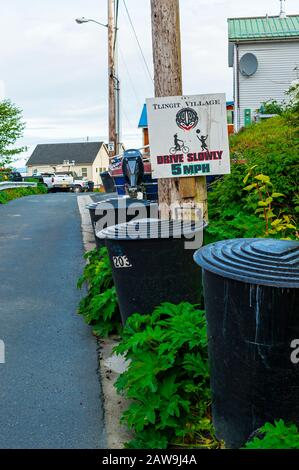 Street scene and Drive Slowly sign on Kaagwaantaan street in Sitka, Alaska, USA Stock Photo