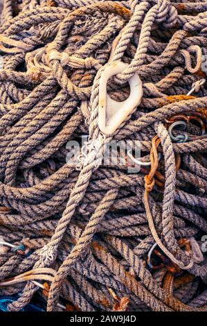 Spooled up and stowed rope and twisted nylon line, used for