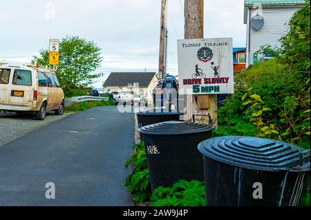 Street scene and Drive Slowly sign on Kaagwaantaan street in Sitka, Alaska, USA Stock Photo