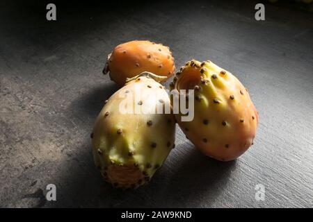 Cactus figs (Opuntia ficus-indica) on a kitchen table Stock Photo