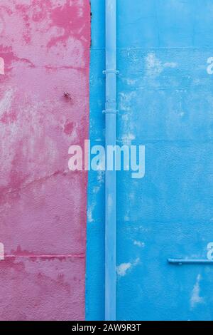 Pink and blue painted wall in Burano, Venice, Italy Stock Photo