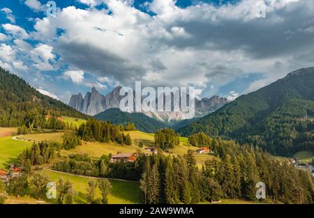 Church of St. Magdalena and Felder, Villnoesstal, in the back Geislergruppe with Sass Rigais, St. Magdalena, Bozen, South Tyrol, Italy Stock Photo