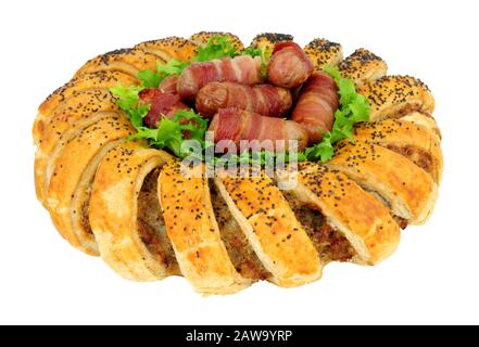 Puff pastry garland ring filled with seasoned pork sausage meat with pigs in blankets in the center isolated on a white background Stock Photo