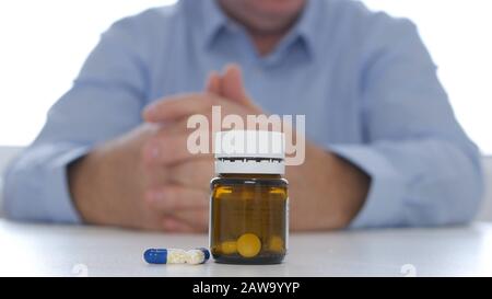Closeup Image with a Recipient with Medical Pills on the Table Stock Photo
