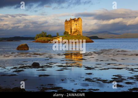 Castle Stalker on  Loch Laich near Oban in the West Highlands of Scotland on a lovely morning. Stock Photo