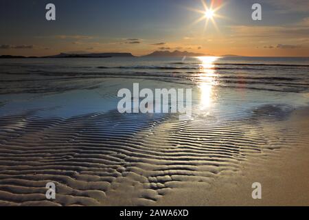 Silversands Beach near Mallaig on a Summer Evening with the Isles of Eigg and Rum in the distance. Stock Photo