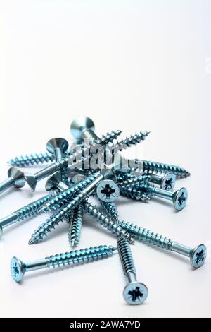 Steel wood screws isolated on a white background with space for copy Stock Photo