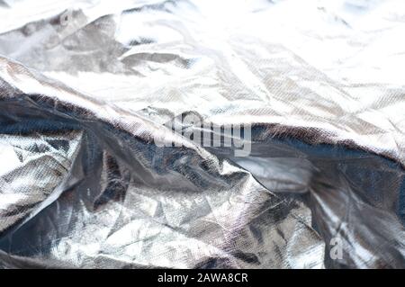 Background from crumpled silver fabric. Stock Photo