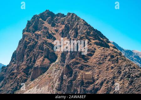 Pinkuylluna Mountain Landscape and Inca Storehouse Ruins in the Sacred Valley near Ollantaytambo, Peru Stock Photo