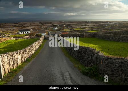 Road and view on Inishmaan island, middle of the Aran islands on the Wild Atlantic Way in Galway Ireland Stock Photo