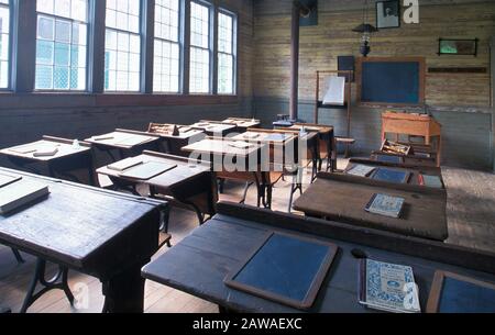 Interior of a  old-fashioned 19 century classroom in a one room schoolhouse Stock Photo