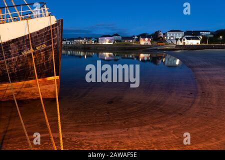 Boat moored in harbour on Inishmore island, largest of the Aran islands on the Wild Atlantic Way in Galway Ireland Stock Photo