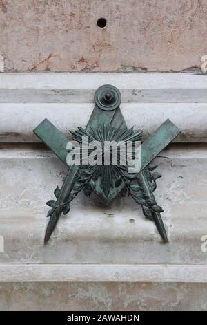 Freemasonry bronze symbol in Bologna, Italy, part of Ugo Bassi monument Stock Photo