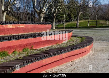 Geometric oval shaped seating bench at park Stock Photo