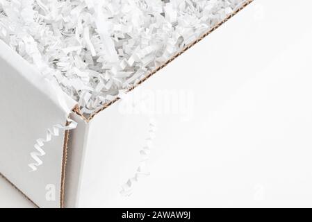 A close-up studio shot of a generic open white packaging box set on a plain white background. Stock Photo