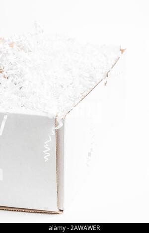 A close-up studio shot of a generic open white packaging box set on a plain white background. Stock Photo