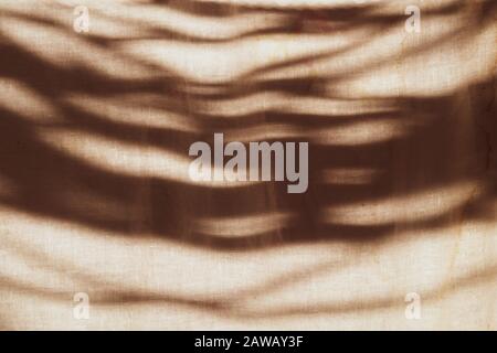 Brown fabric texture. lights and shadows on the cloth. textile background Stock Photo