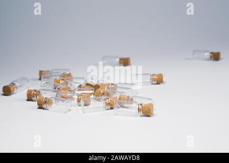 Empty little bottles with cork stopper isolated on white Stock Photo