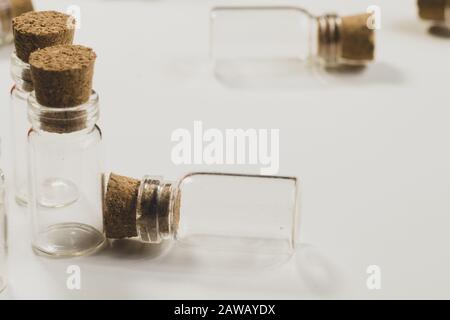 Empty little bottles with cork stopper isolated on white Stock Photo