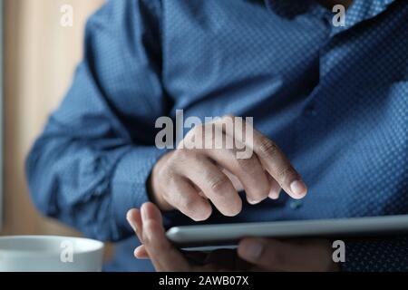 Businessman using digital tablet for investment at office  Stock Photo