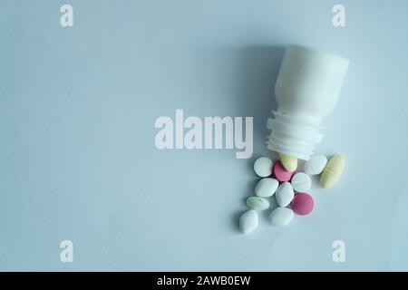 top view of pill spilling from container  Stock Photo