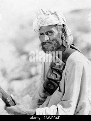 Photograph taken in 1930 by ERNEST B. SCHOEDSACK of a MOUNTAIN TRIBESMAN taken on expedition to film Location Footage in India for proposed movie from the book THE LIVES OF A BENGAL LANCER by Francis Yeats Brown Paramount Pictures Stock Photo