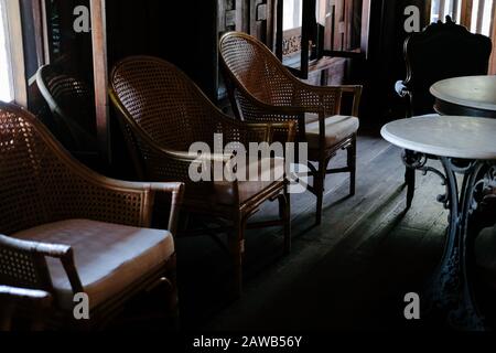 old vintage retro wicker rattan chair in living room interior Stock Photo