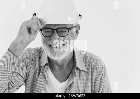 Happy professional healthy elder worker portrait of smiling senior engineer work man black and white monotone Stock Photo