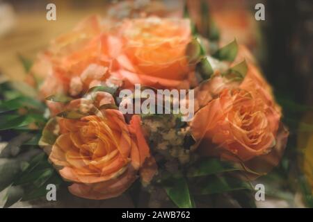 Bouquet of roses with double exposure abstract background. blurred flowers