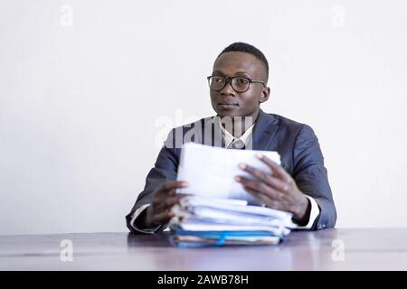 Authentic charming african american working manager looking concentrated Stock Photo