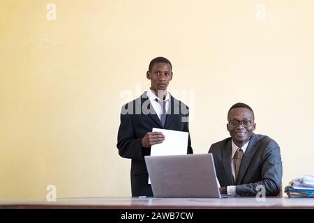 African ethnicity business people studying together as a technology symbol Stock Photo