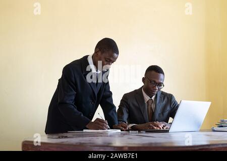 Two Real African Black Businessmen Working Together Stock Photo