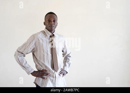 Handsome African Black Ethnicity Boy with shirt posing for camera Stock Photo