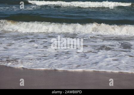 closeup of the power of nature on beach , big white wave water on blue beach ,coast line Stock Photo