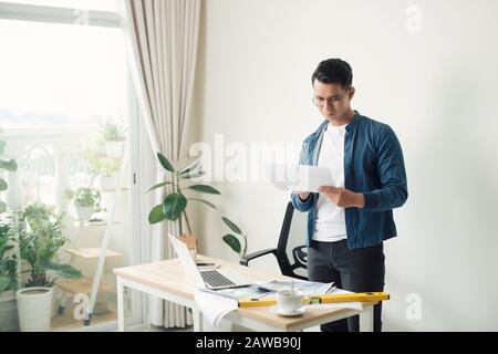 architect working at his laptop on the office Stock Photo