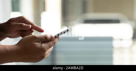 Man using smartphone using the phone for work everyday internet online Stock Photo