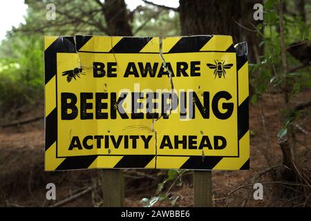 'Bee Aware' beekeeping activity warning sign in yellow and black with a ...