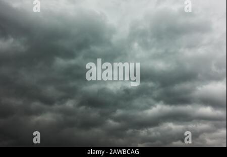 Dramatic sky  -  Gray stormy sky with lots of heavy clouds, may be used as background Stock Photo